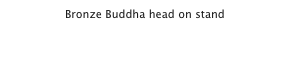 Bronze Buddha head on stand